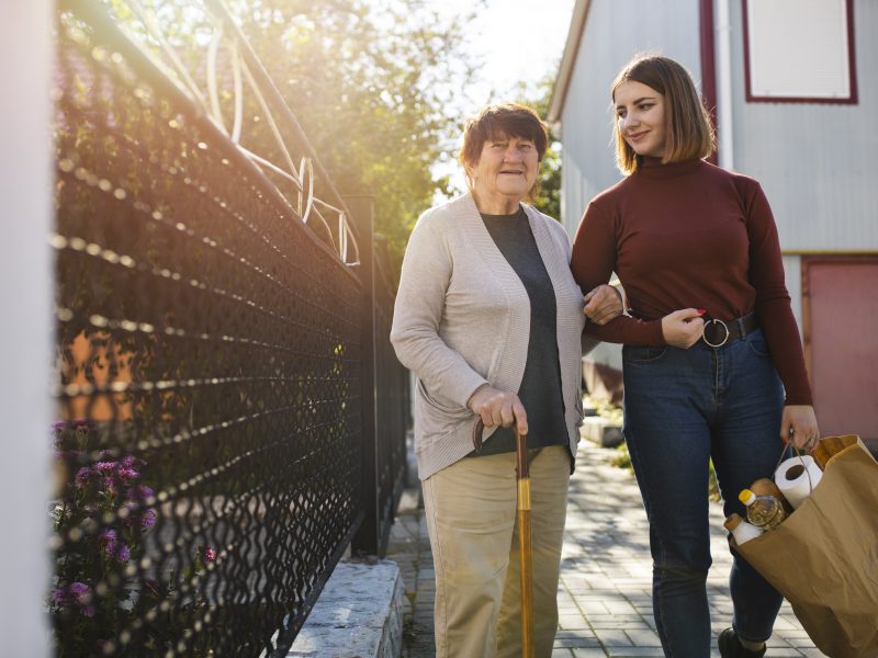 person-helping-their-elder-neighbour